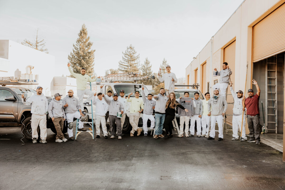 The Rojas Painting crew with the company trucks