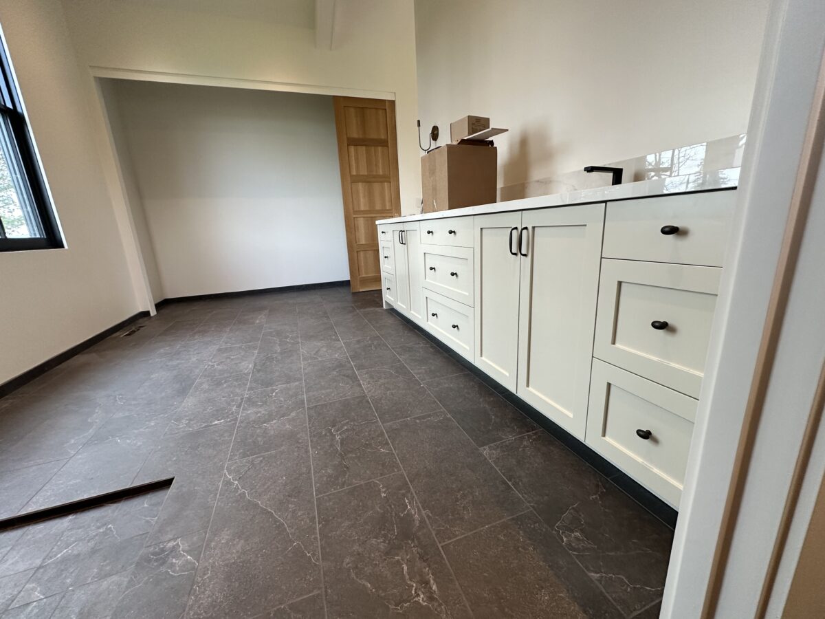 Long run of white painted built-in cabinets
